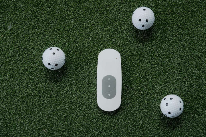 Retractable garage golf simulator impact screen with netting.