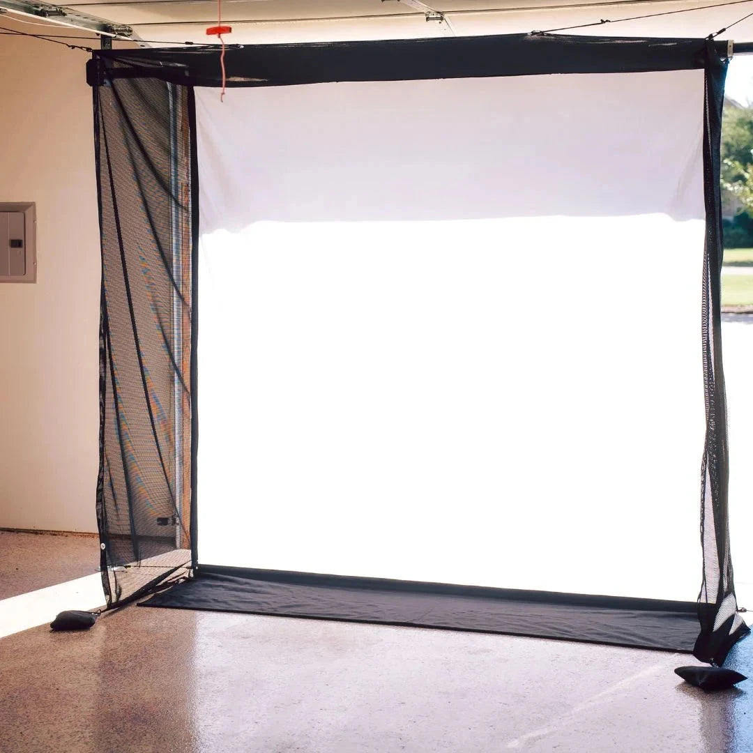 Retractable garage golf simulator impact screen with netting.