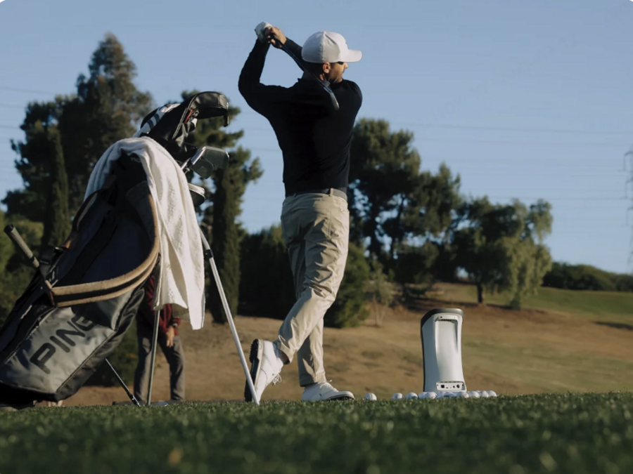 GOLFJOY Spica 3 portable golf launch monitor on the golf course.
