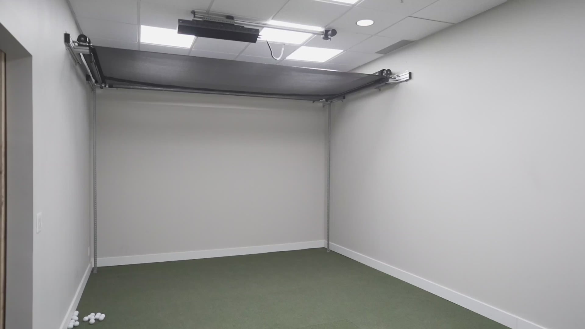 Sport Screen Vanish retractable golf simulator bay and screen enclosure.