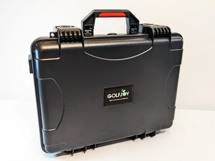 The black hard-shell case with a red handle and GOLFJOY logo protects your GolfJoy GDS Plus Launch Monitor or other golf simulator essentials.
