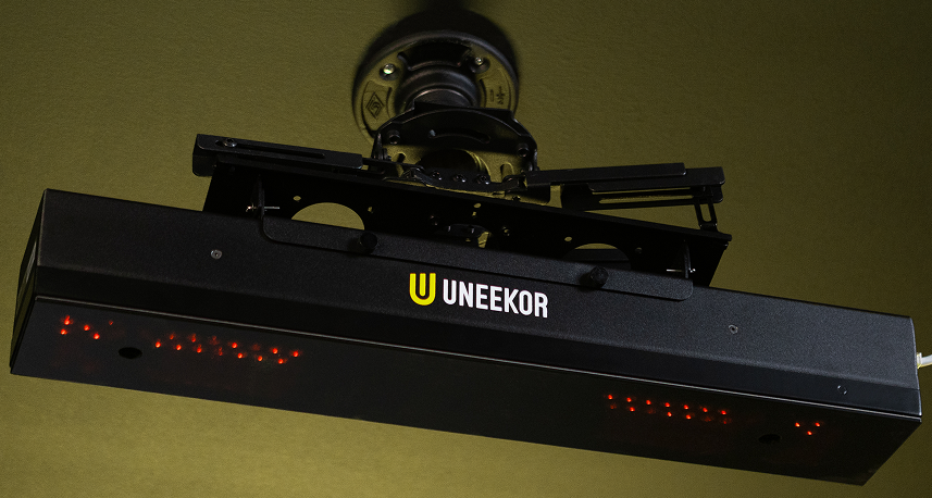 Uneekor EYE XR rear mounted golf simulator launch monitor featuring a compact, minimalist design that blends seamlessly into modern setups.