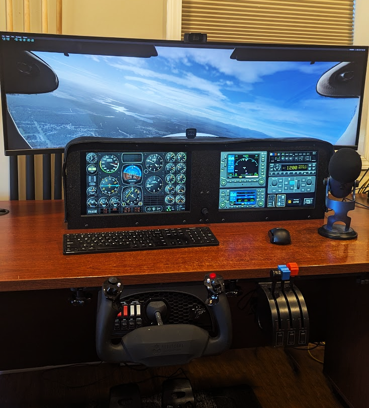 A flight simulator dash panel with two touchscreen monitors and knobster running Air Manager.