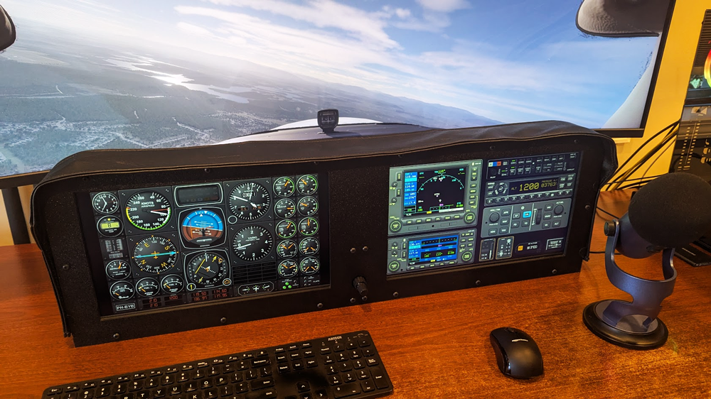 A flight simulator dash panel with two touchscreen monitors and knobster running Air Manager.