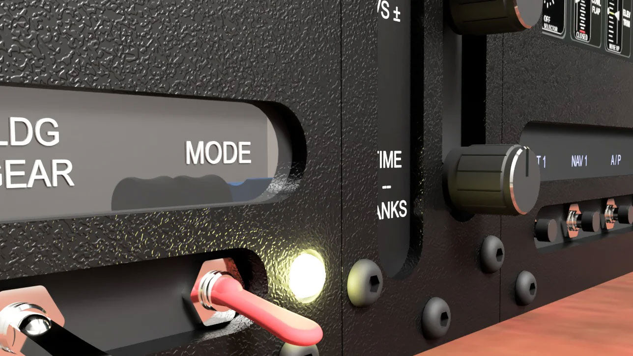 Close-up of the ALLSPORTSYSTEMS Flexible Instrument Panels and Dashes, showcasing a "MODE" switch, glowing indicator light, and various knobs and connectors—perfect for your desk-sized home flight simulator.